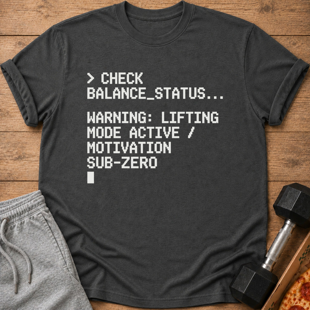 Dark t-shirt with white text: "CHECK BALANCE_STATUS... WARNING: LIFTING MODE ACTIVE / MOTIVATION SUB-ZERO"