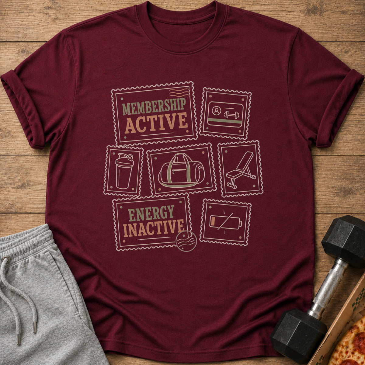 Maroon t-shirt with "Membership Active" and gym icons in stamp shapes.