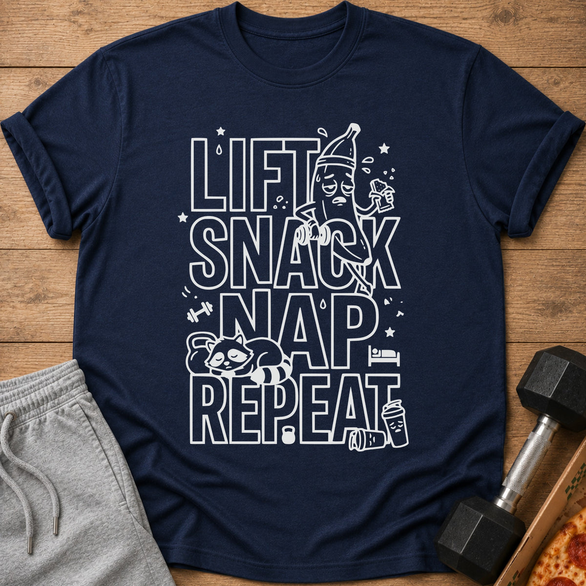 Navy t-shirt with "Lift Snack Nap Repeat" text and cartoon fitness graphics.