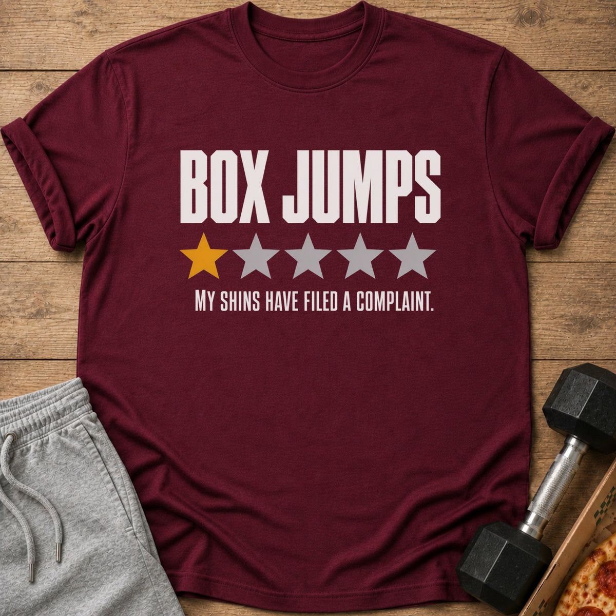 Maroon t-shirt with "BOX JUMPS" and one gold star out of five.