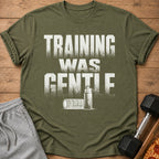 Green t-shirt with white text "TRAINING WAS GENTLE" and workout graphics.