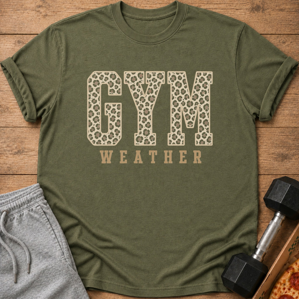 Olive green t-shirt with "GYM WEATHER" in leopard print and tan letters.