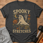T-shirt with "Spooky Stretches" text and Halloween-themed yoga ghost, cat, and pumpkin.