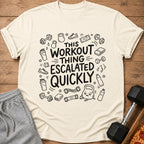 T-shirt with "This workout thing escalated quickly" text and workout graphics.