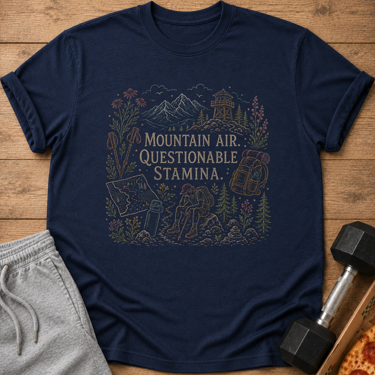 Navy t-shirt with "Mountain Air, Questionable Stamina" text and hiker illustration.
