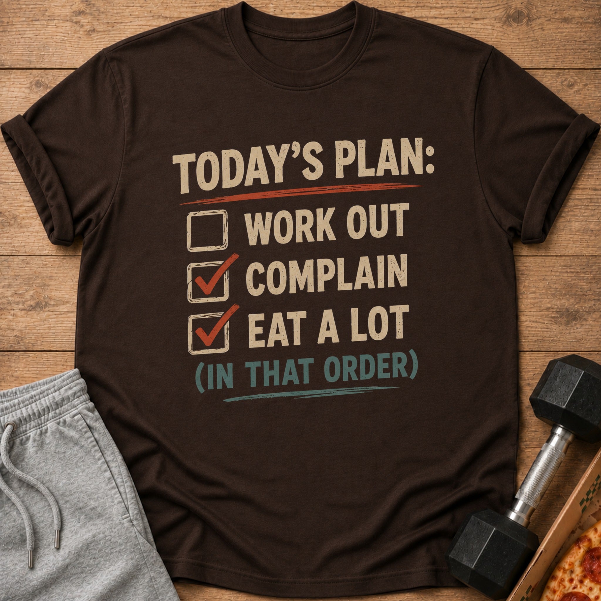 Brown t-shirt with checklist: "Today's plan: Work out, complain, eat a lot".