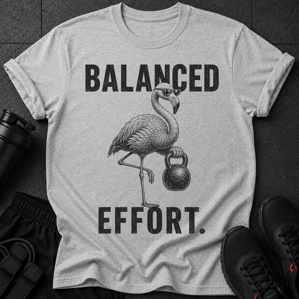 Grey t-shirt with black graphic of flamingo wearing sunglasses holding kettlebell and text "BALANCED EFFORT."