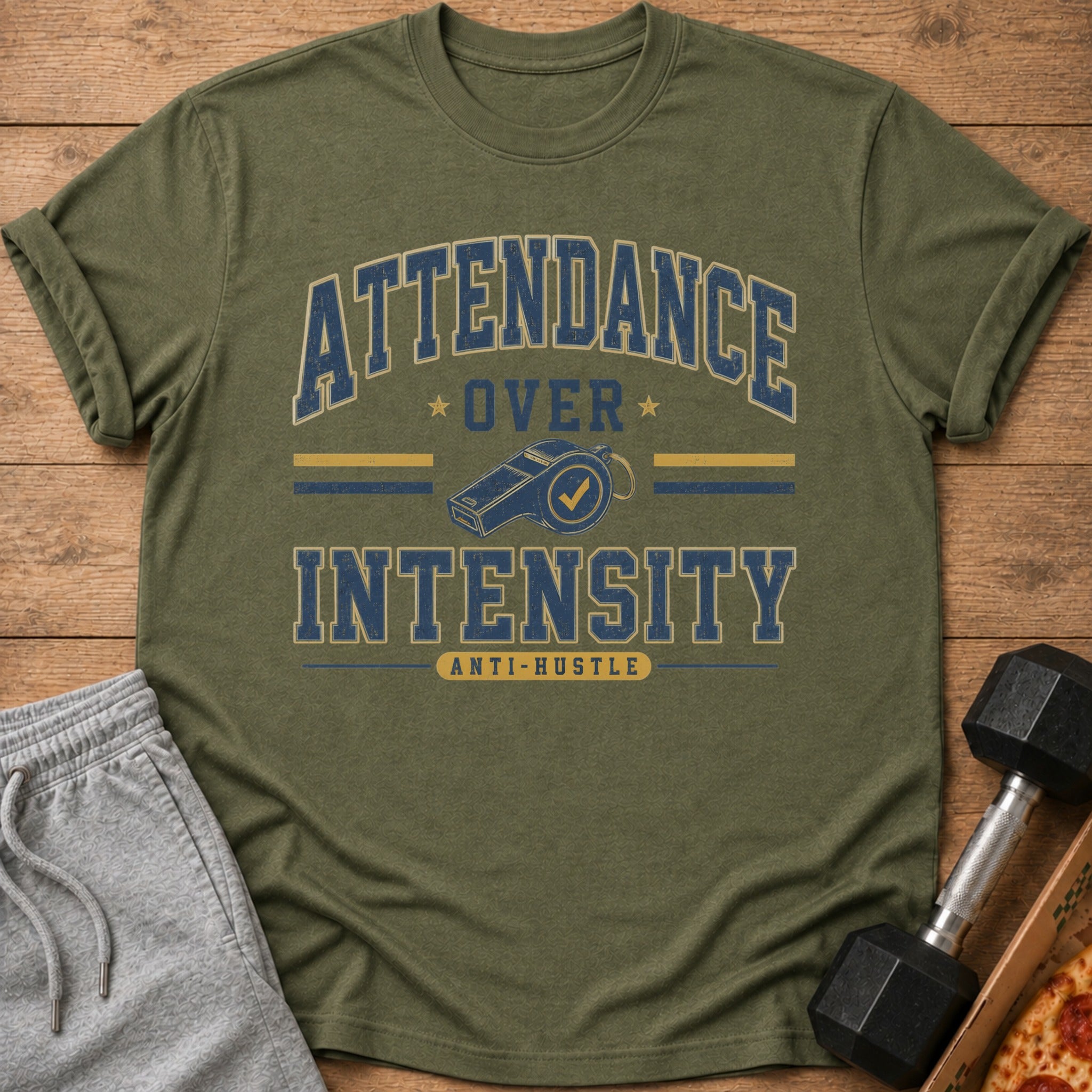 Green t-shirt with "Attendance Over Intensity" and whistle graphic.