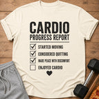 Cream t-shirt with "Cardio Progress Report" and checked list.