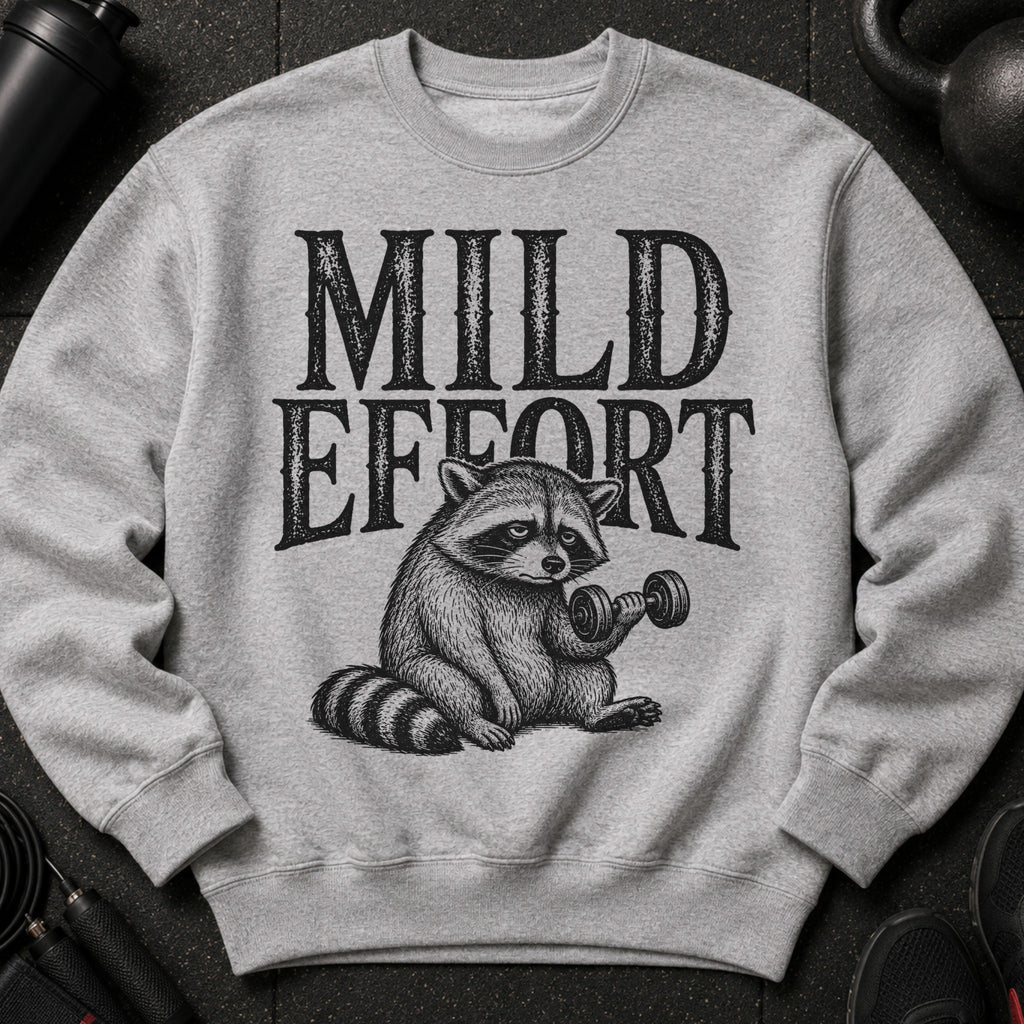 Grey sweatshirt with "MILD EFFORT" text above a raccoon lifting a dumbbell.