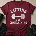 Maroon t-shirt with barbell graphic and text about lifting.