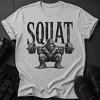 Bigfoot character lifting a barbell with the word "SQUAT" above.