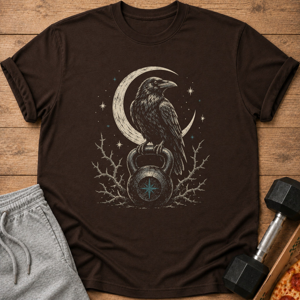 Brown t-shirt with crow on kettlebell and crescent moon graphic.