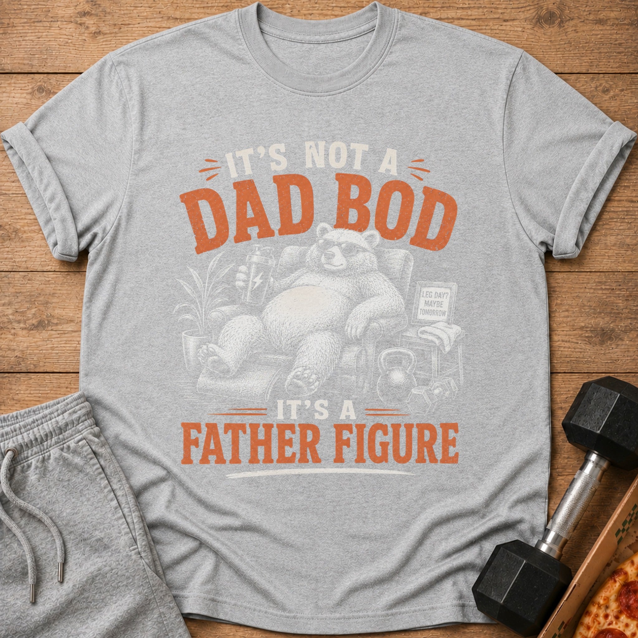Gray t-shirt with a bear sitting in a chair saying "It's not a dad bod, it's a father figure".