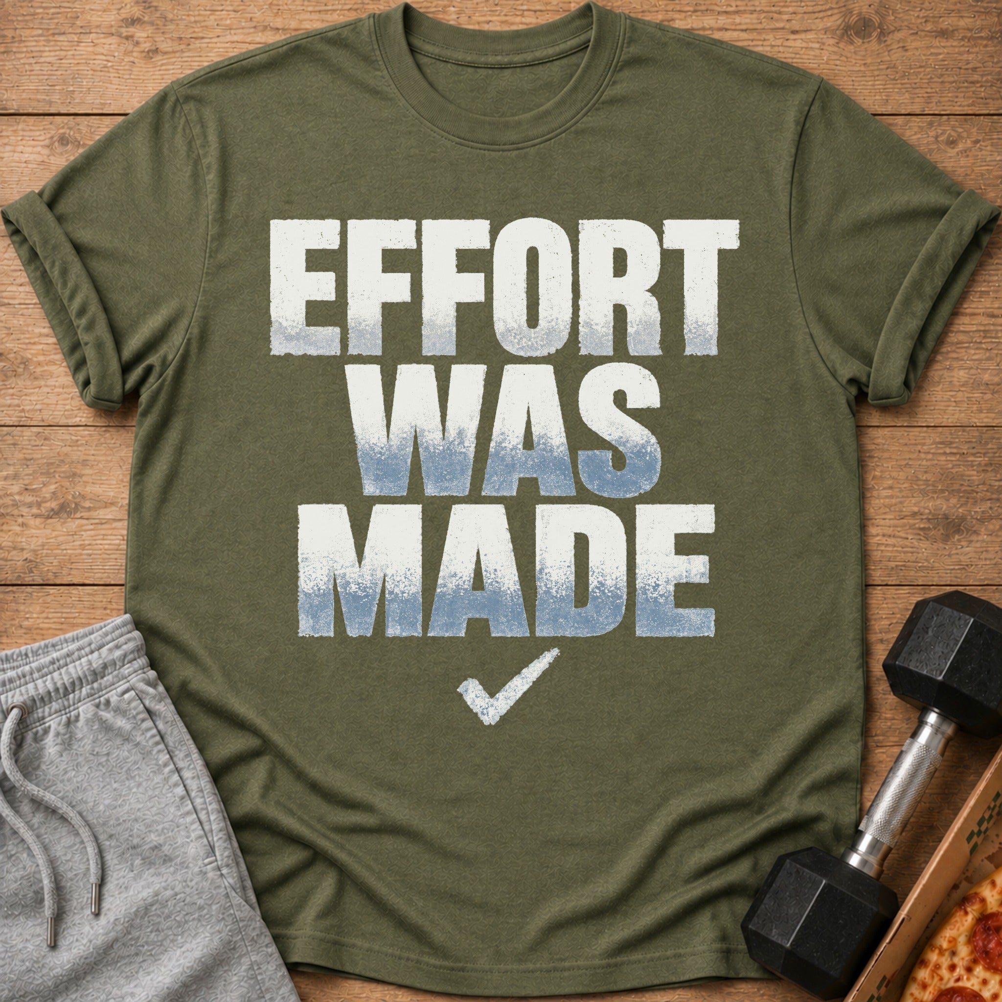 Olive green t-shirt with "EFFORT WAS MADE" text and a checkmark graphic.