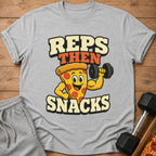 Grey t-shirt with "Reps Then Snacks" text and a pizza slice lifting a dumbbell.