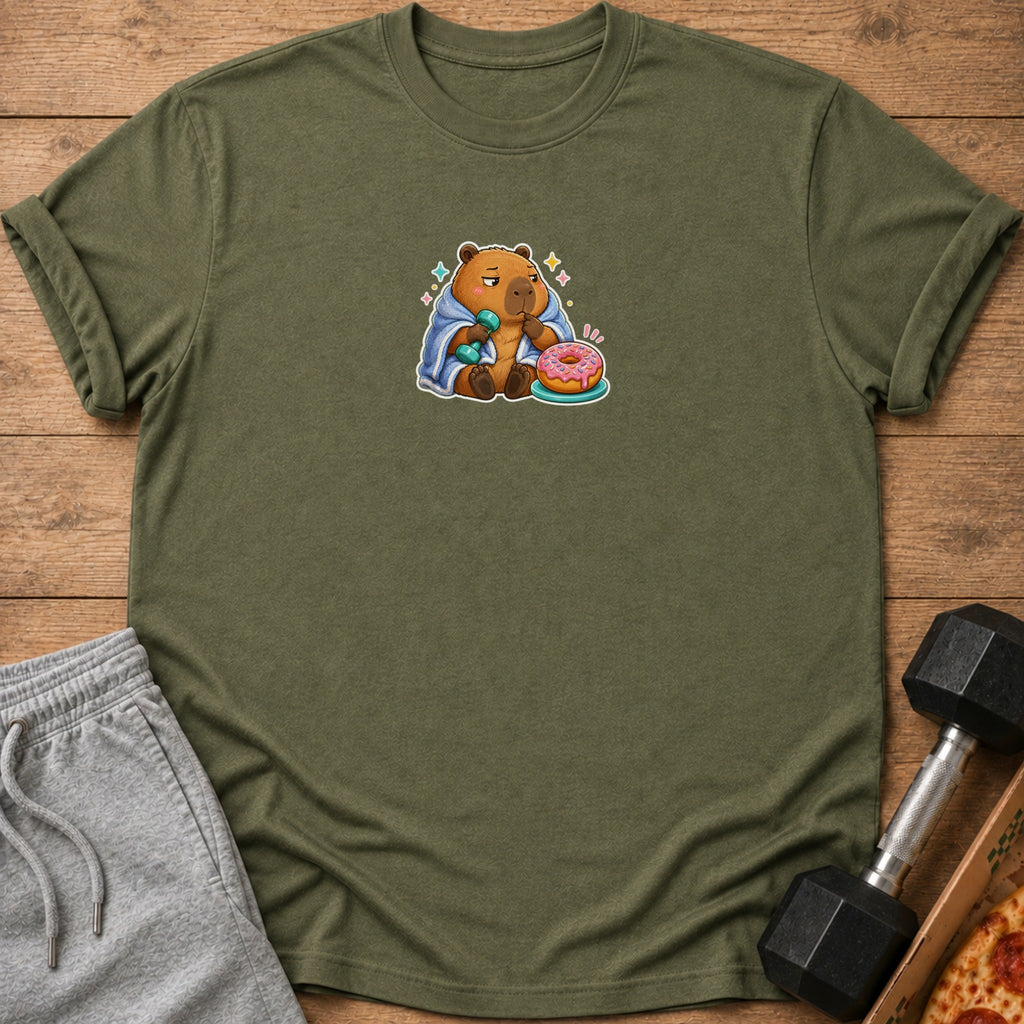 Olive green t-shirt with a cartoon capybara holding a dumbbell and a donut.