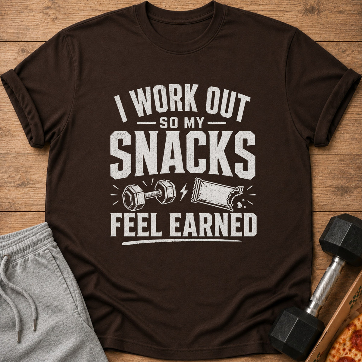 Brown t-shirt with "I WORK OUT SO MY SNACKS FEEL EARNED" text and graphics.
