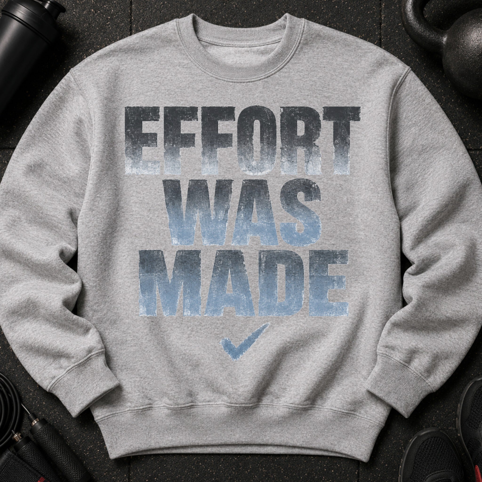 Grey sweatshirt with "EFFORT WAS MADE" graphic and a checkmark.
