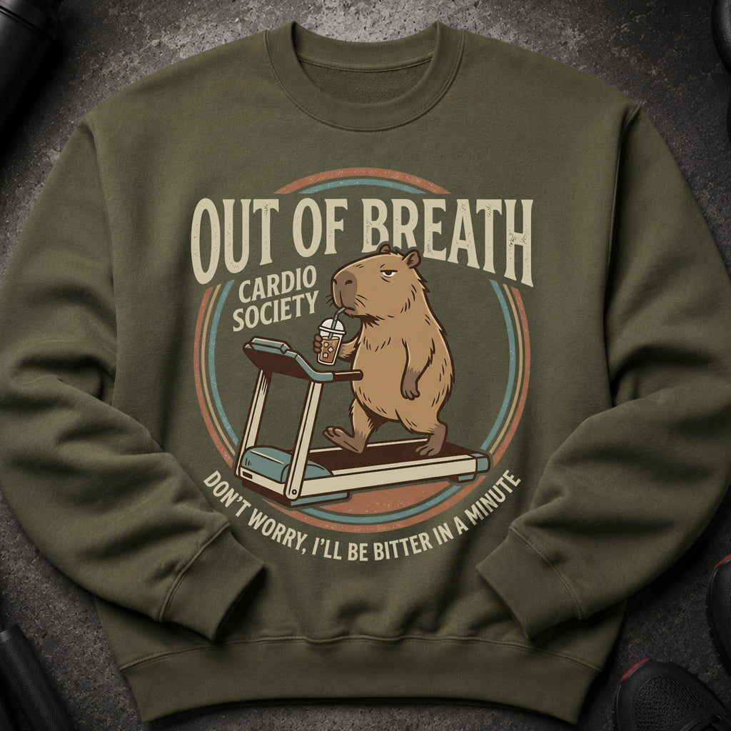 Green sweatshirt with a cartoon capybara on a treadmill that reads "Out of Breath Cardio Society."
