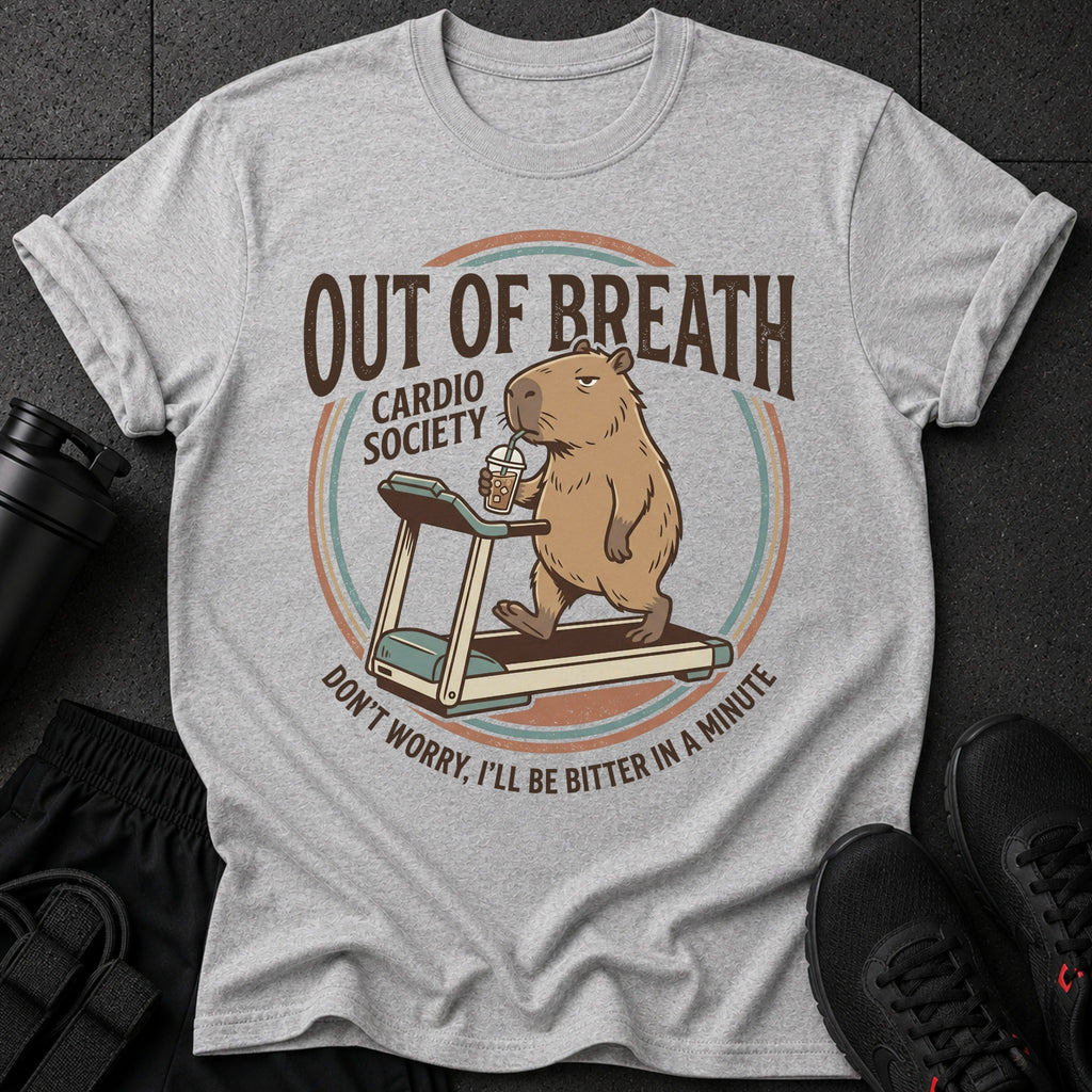 Gray t-shirt with cartoon capybara on treadmill, text "OUT OF BREATH CARDIO SOCIETY DON'T WORRY, I'LL BE BITTER IN A MINUTE."