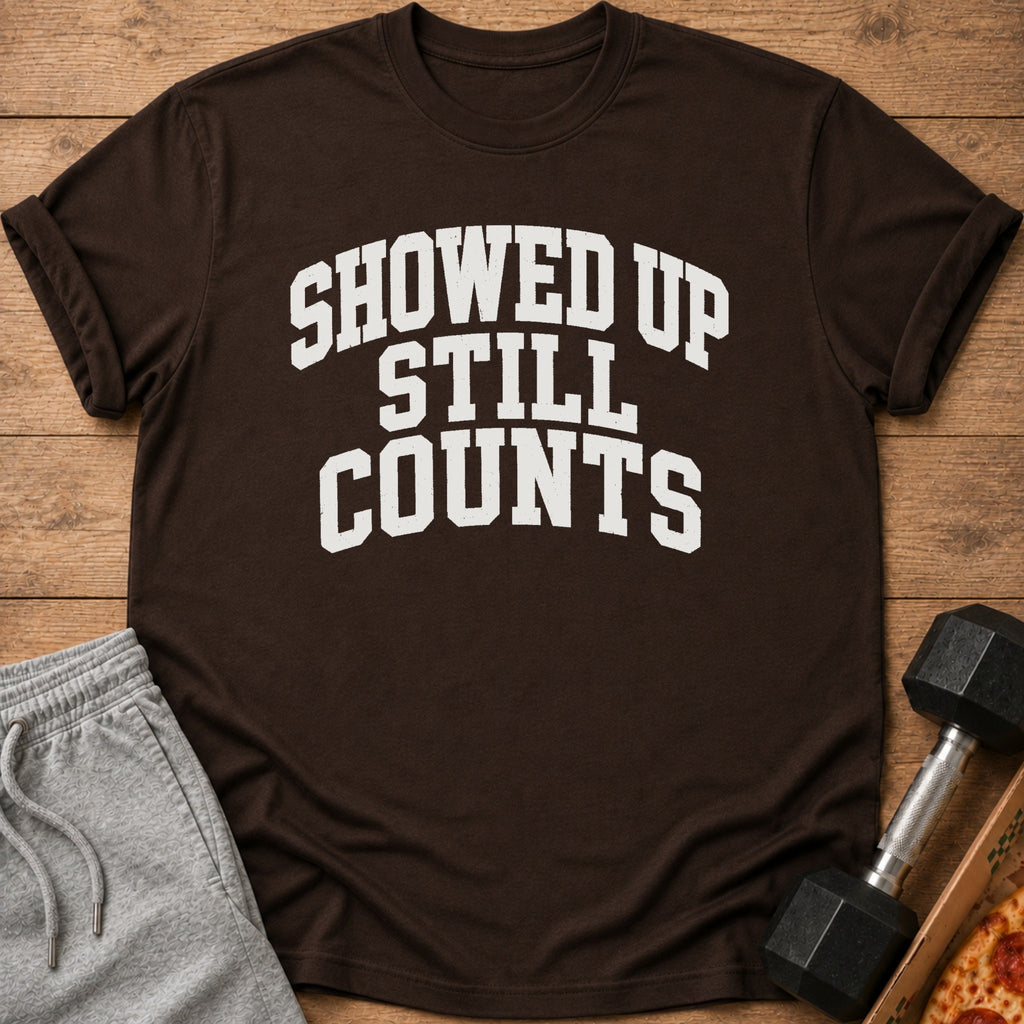 Brown t-shirt with white text that reads "SHOWED UP STILL COUNTS".