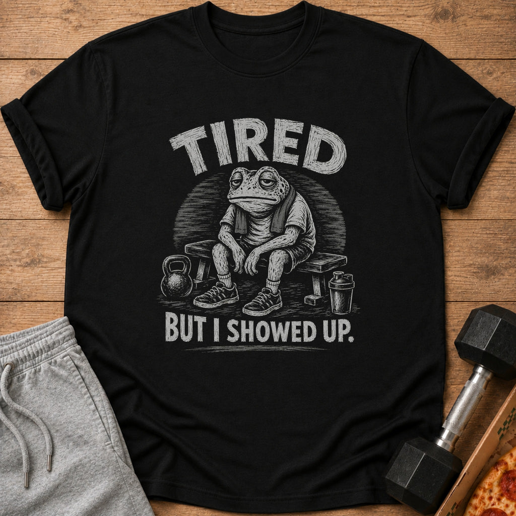 Black t-shirt with tired frog graphic and text "TIRED BUT I SHOWED UP."