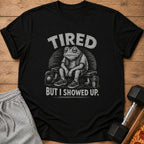 Black t-shirt with tired frog graphic and text "TIRED BUT I SHOWED UP."