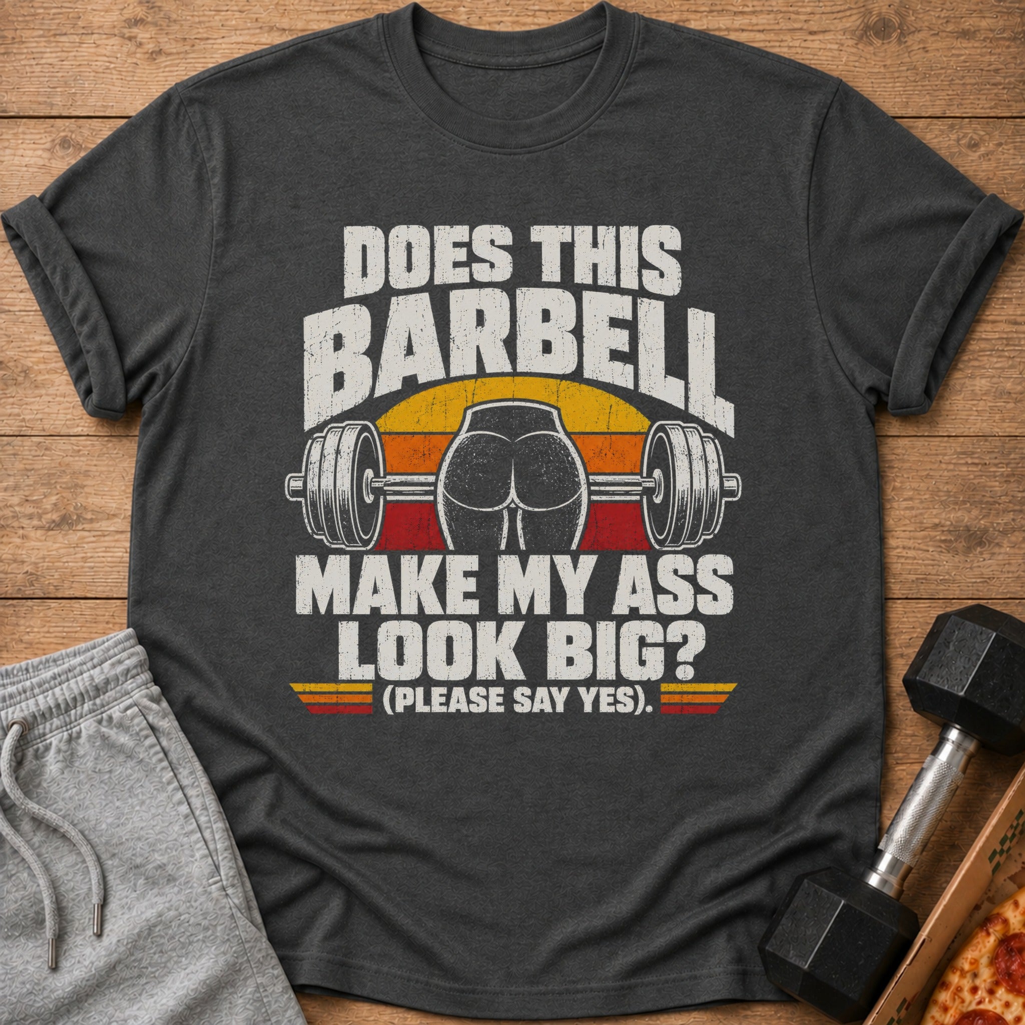 Dark gray t-shirt with text "Does this barbell make my ass look big? (Please say yes)."