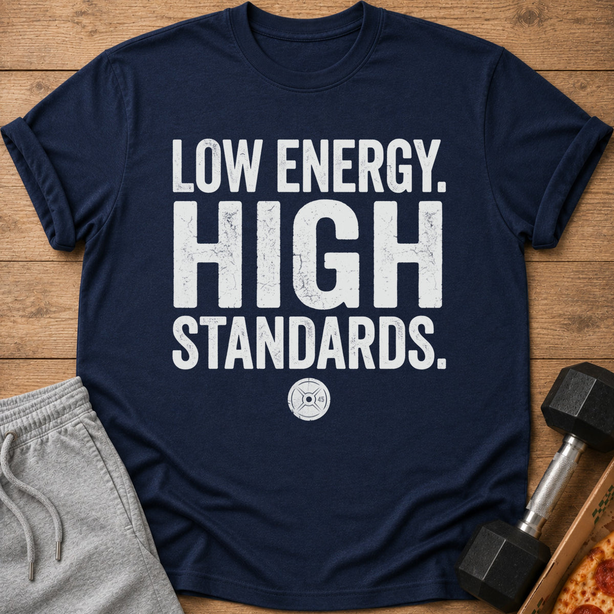 Navy t-shirt with white text "LOW ENERGY. HIGH STANDARDS." and a weight plate logo.