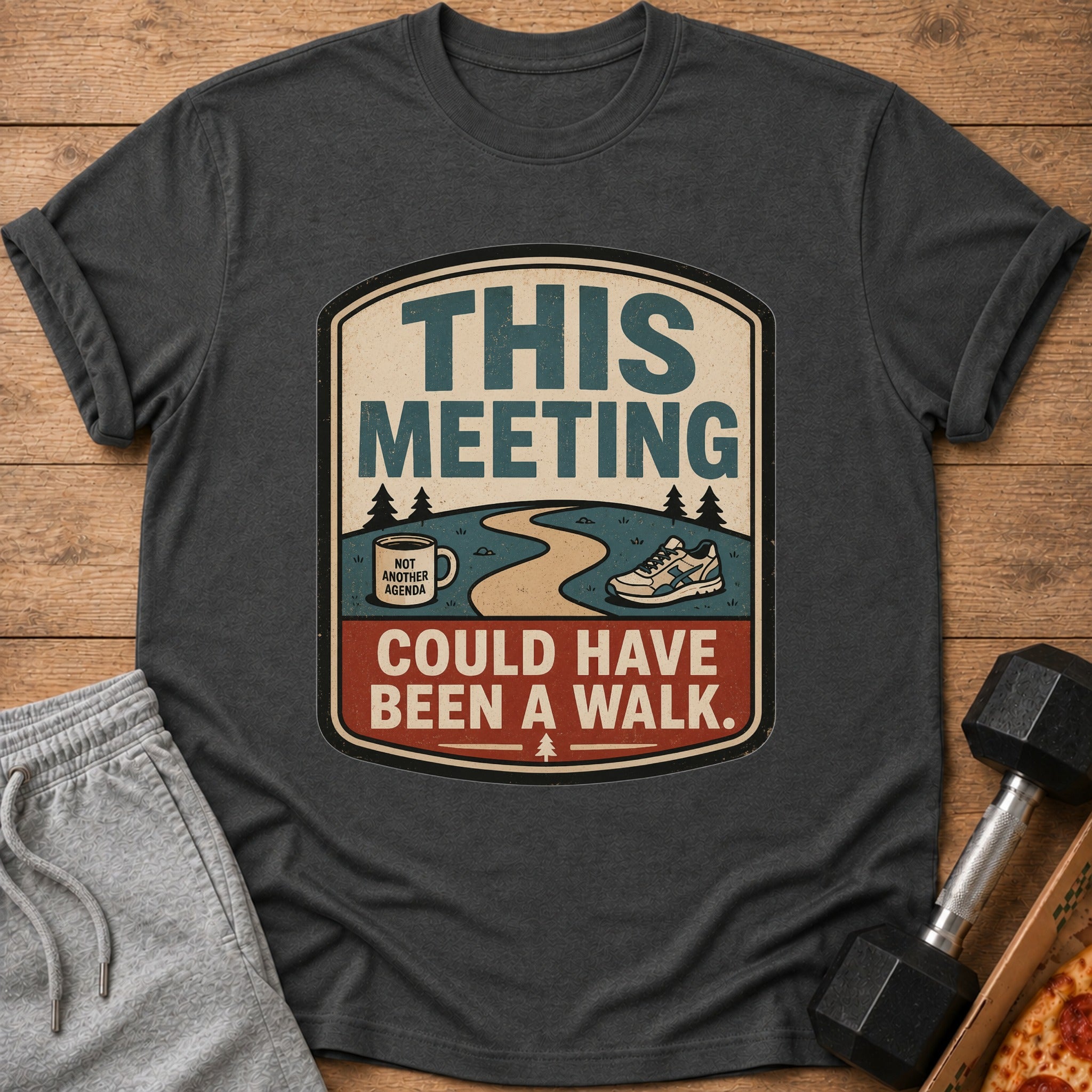 Dark t-shirt with text graphic "THIS MEETING COULD HAVE BEEN A WALK."