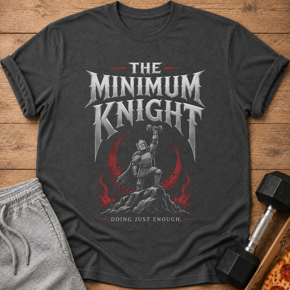 Dark grey t-shirt with "The Minimum Knight" text and a knight lifting a dumbbell.