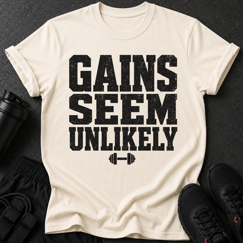 Cream t-shirt with black distressed text "GAINS SEEM UNLIKELY" and a dumbbell icon.