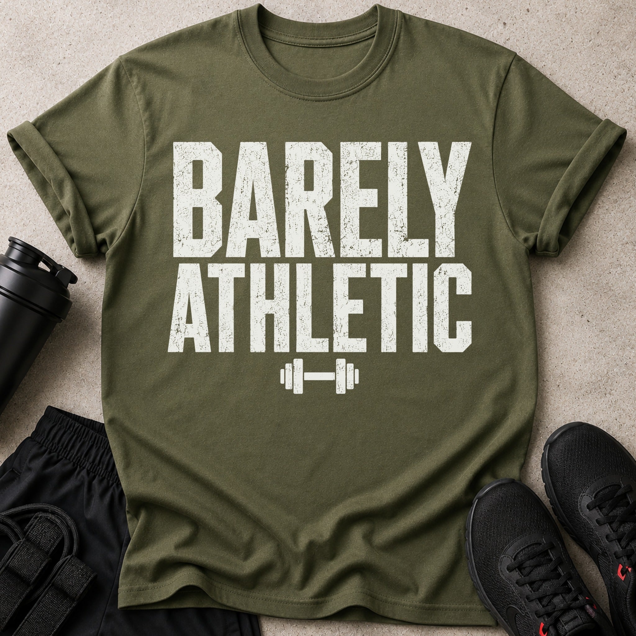 Olive green t-shirt with distressed white text "BARELY ATHLETIC" and a dumbbell graphic.