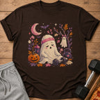 Tired ghost with headband sits by dumbbell, pumpkin, and kettlebell under crescent moon.