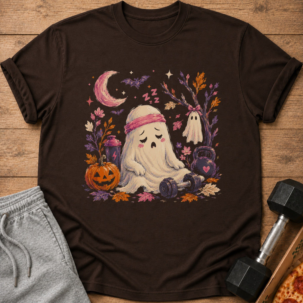 Tired ghost with headband sits by dumbbell, pumpkin, and kettlebell under crescent moon.