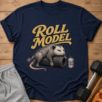 Opossum lying on a foam roller with "Roll Model" text and "Hydrate or Die-Drated" water bottle.
