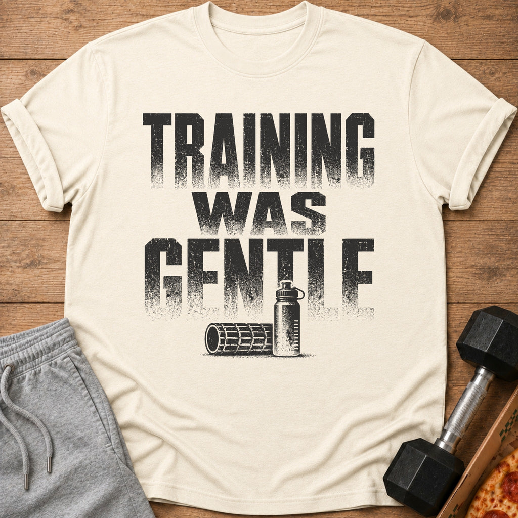 Cream t-shirt with "TRAINING WAS GENTLE" text, water bottle, and foam roller graphic.