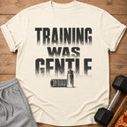 Cream t-shirt with "TRAINING WAS GENTLE" text, water bottle, and foam roller graphic.