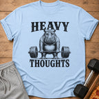 Light blue t-shirt with a hippo lifting weights and text "HEAVY THOUGHTS".