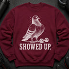 Maroon sweatshirt with a white sketched pigeon and dumbbell, and "SHOWED UP." text.