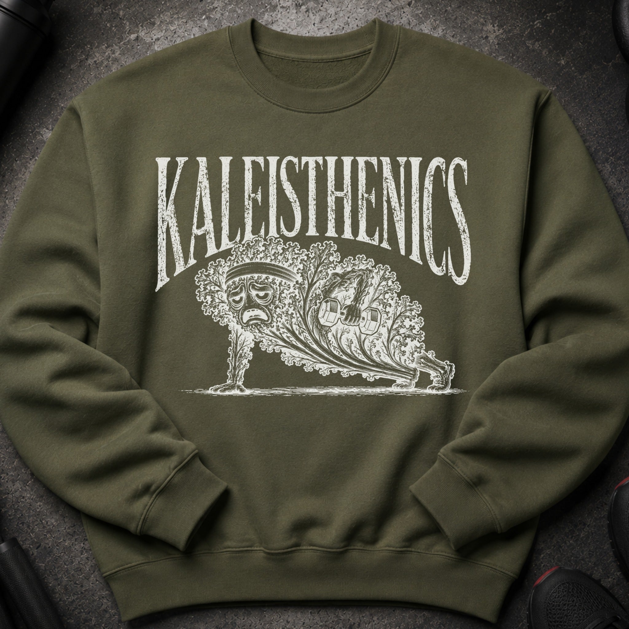 Green sweatshirt with "KALEISTHENICS" text and kale character doing a plank.
