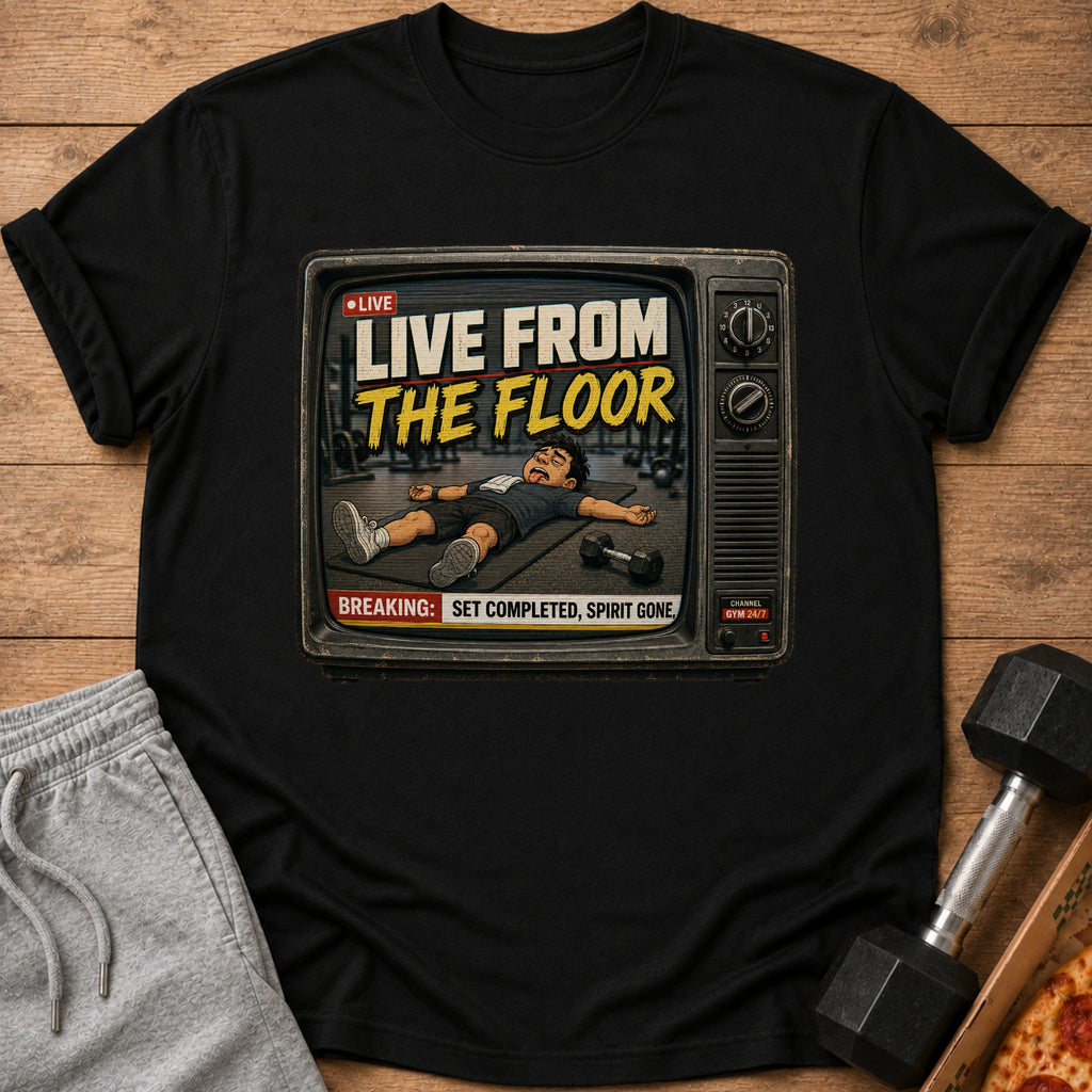 Black t-shirt with "Live From The Floor" text and exhausted cartoon man on vintage TV screen.