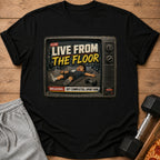 Black t-shirt with "Live From The Floor" text and exhausted cartoon man on vintage TV screen.