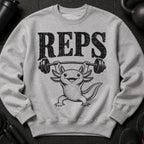 Gray sweatshirt with distressed "REPS" text above an axolotl lifting a barbell.