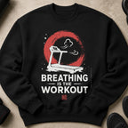 Black sweatshirt with treadmill graphic and text "BREATHING IS THE WORKOUT".