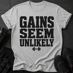 Grey t-shirt with black text that reads "GAINS SEEM UNLIKELY" and a dumbbell icon.