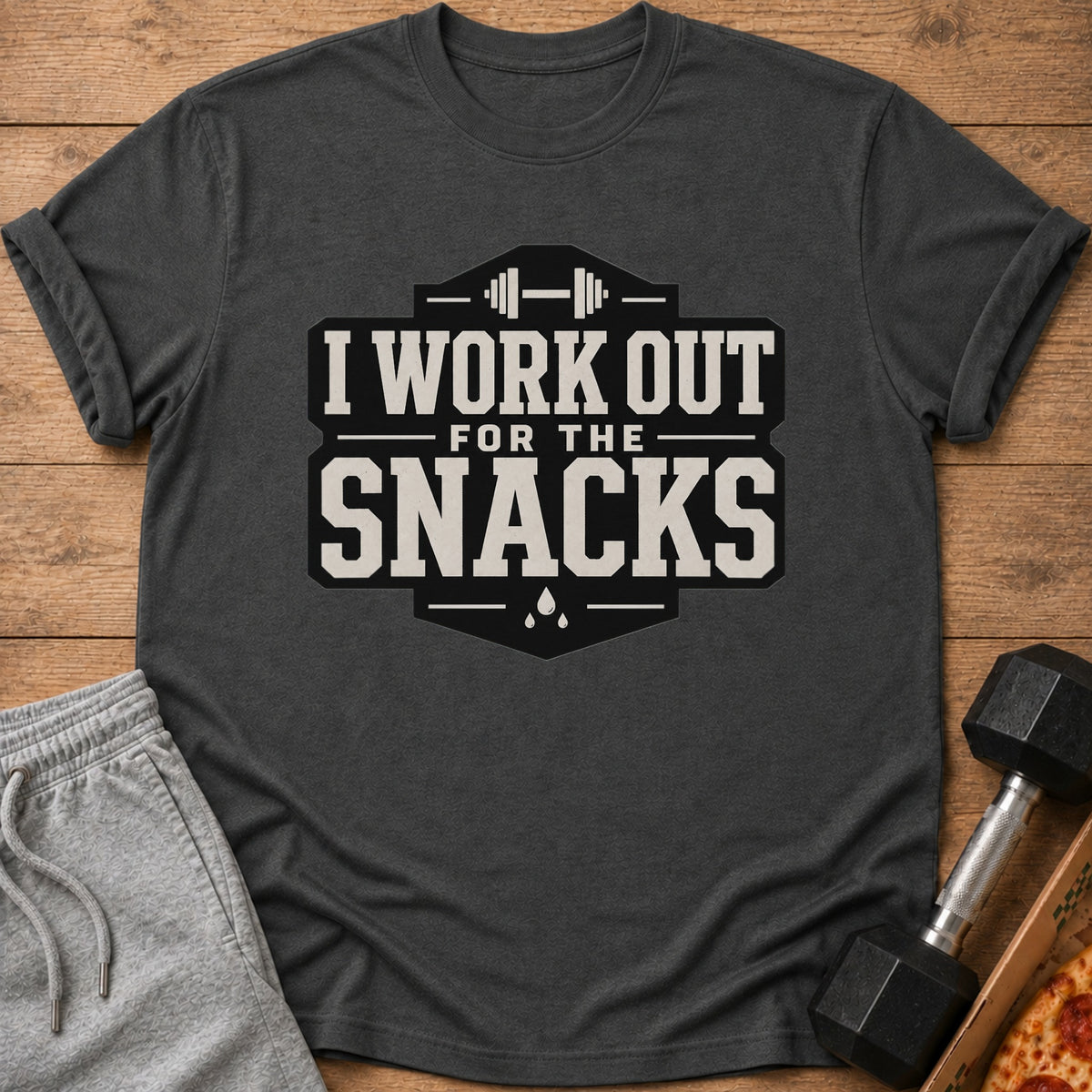 Dark grey t-shirt with "I WORK OUT FOR THE SNACKS" graphic and barbell icon.