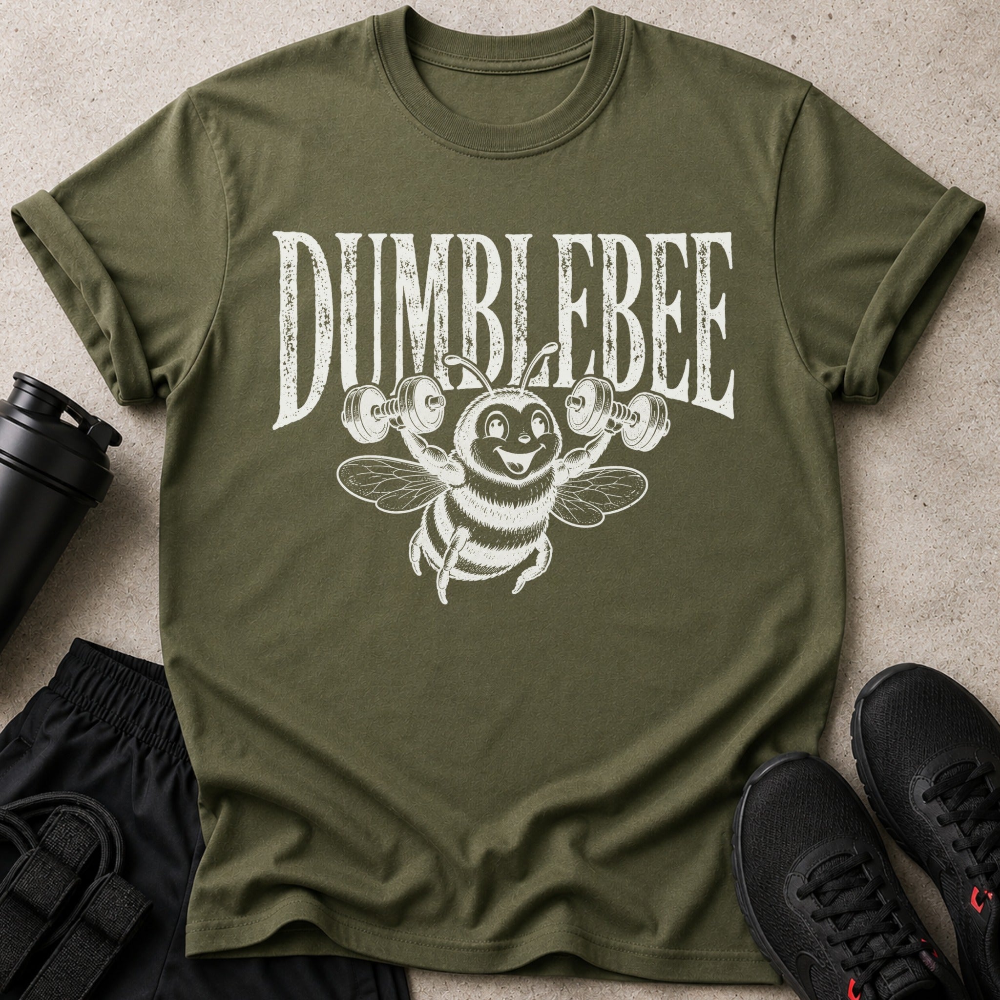Olive green t-shirt with distressed white text "DUMBLEBEE" and cartoon bee lifting weights.
