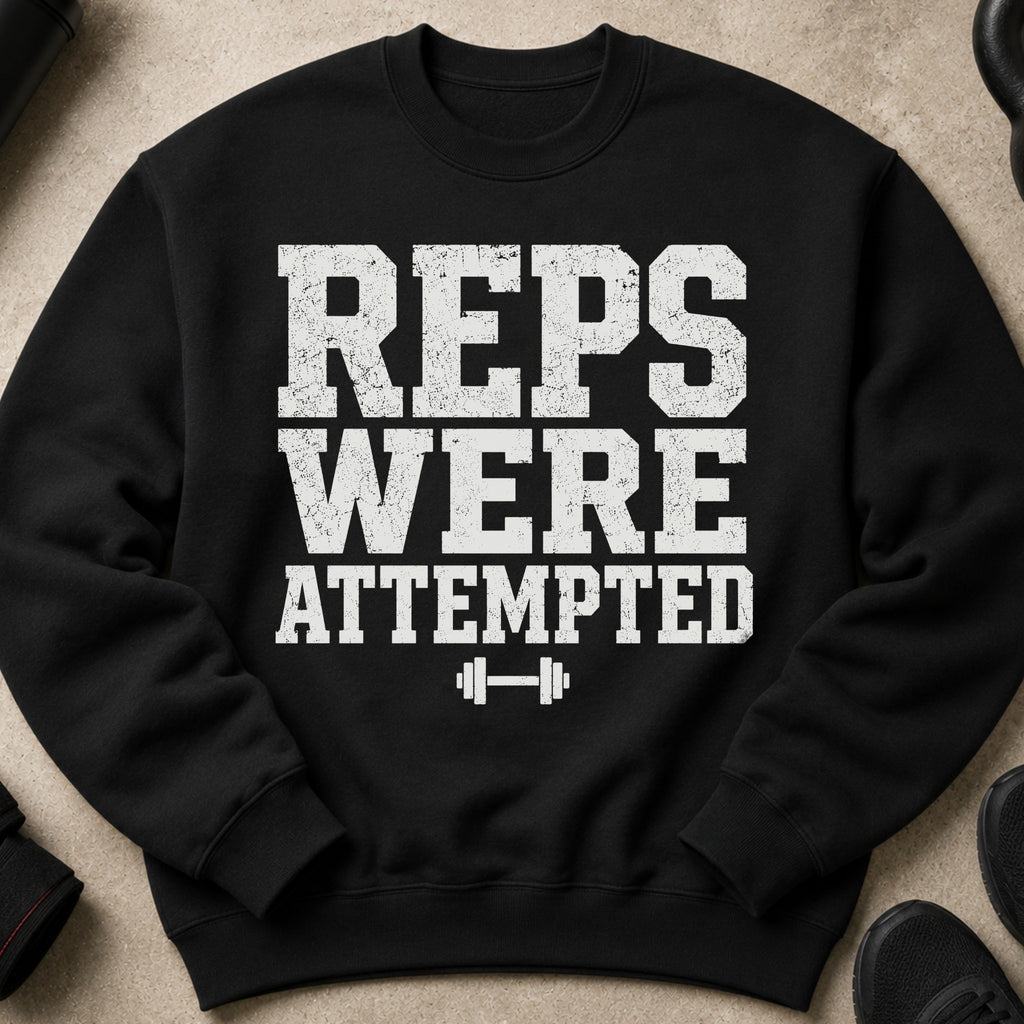 Black sweatshirt with white distressed text "REPS WERE ATTEMPTED" and barbell graphic.